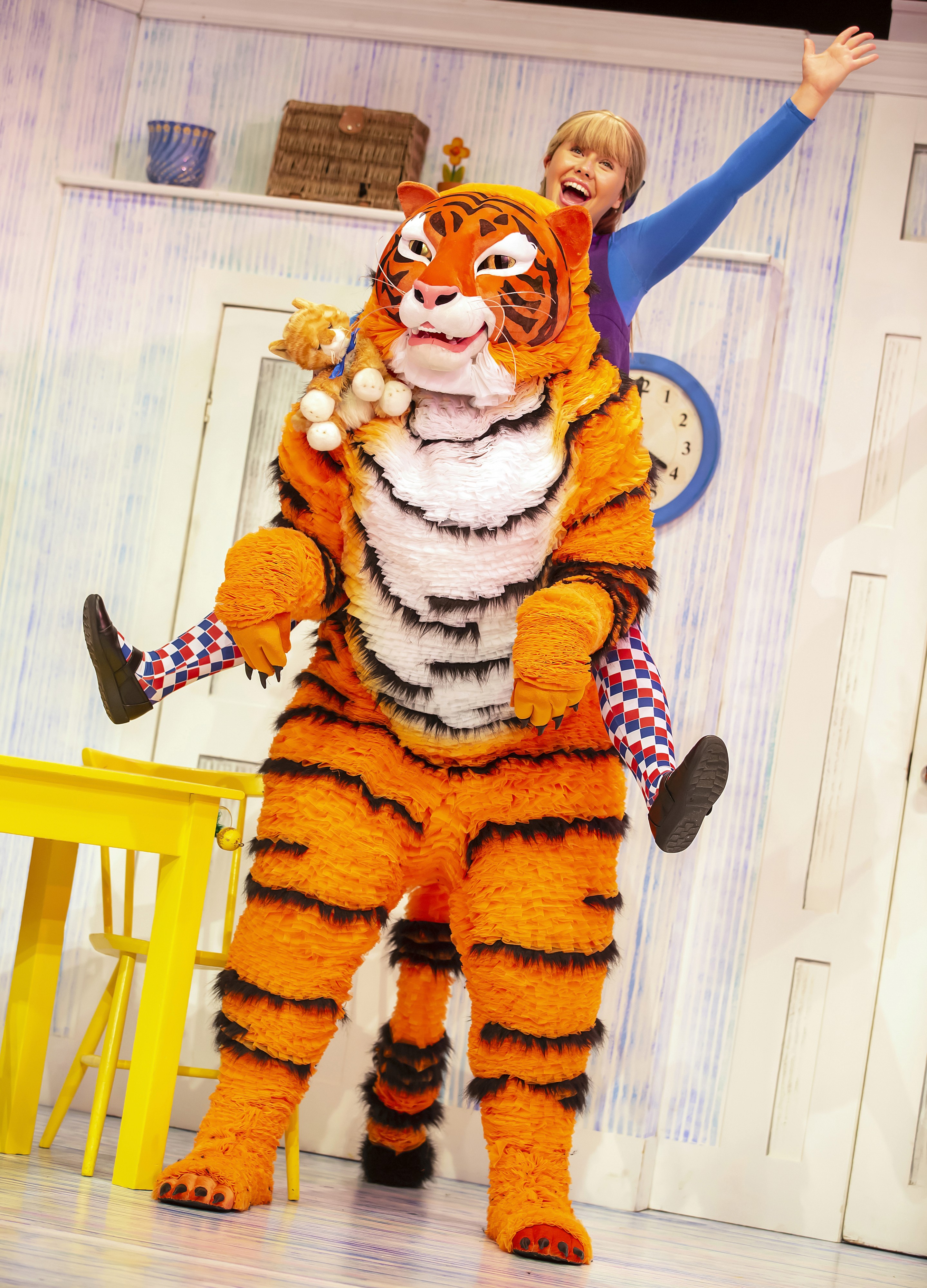 The tiger and a performer dancing on stage